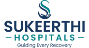 Smiling doctor with patient and family at Sukeerthi Hospital
